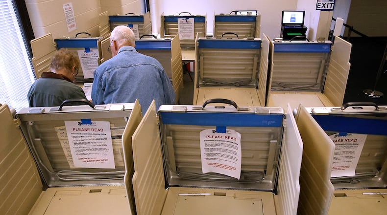 A couple casts their votes at the Clark County Board of Elections Tuesday, Oct. 17, 2023. BILL LACKEY/STAFF