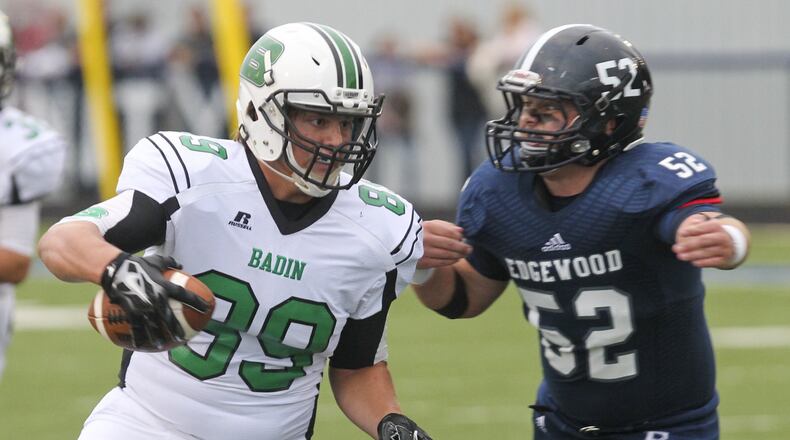 Badin tight end Dominic Valentino (89) catches a pass and tries to elude Edgewood defender Bradey Kallick on Sept. 12, 2014, at Kumler Field in St. Clair Township. GREG LYNCH/STAFF