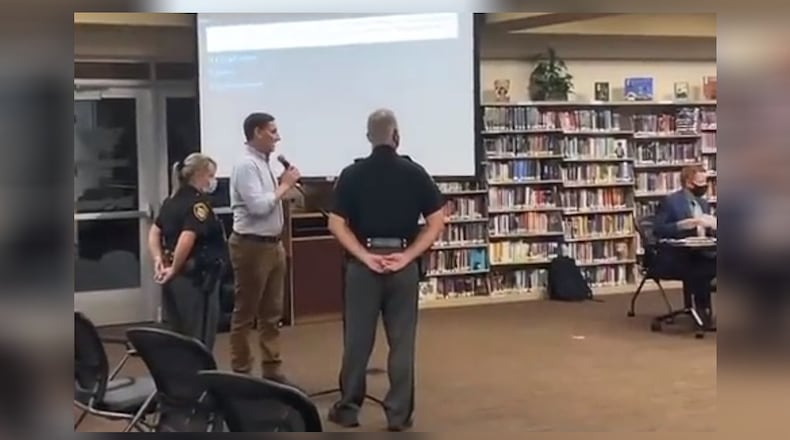 U.S. Senate candidate Josh Mandel was asked to leave the Oct. 11, 2021, school board meeting after he questioned the board on its mask mandate policy. The board cited Mandel was not a resident of the district. Residents or designees of residents are permitted to speak, according to the district. A woman said she designated Mandel to speak on her behalf, but the board said she "yielded" her time and did not formally designate him. SCREEN CAPTURE/TWITTER.COM/JOSHMANDELOHIO