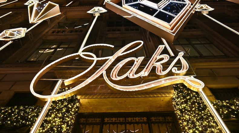 FILE - Holiday decorations are displayed during Saks Fifth Avenue's holiday light show and window reveal, Nov. 24, 2025, in New York. (Photo by Evan Agostini/Invision/AP, File)