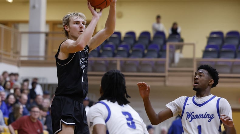 Badin's Cooper Ollis puts up a shot during their Division II Regional semifinal basketball game against Wyoming Thursday, March 14, 2024 at Vandalia Butler High School. Wyoming won 50-38. NICK GRAHAM/STAFF