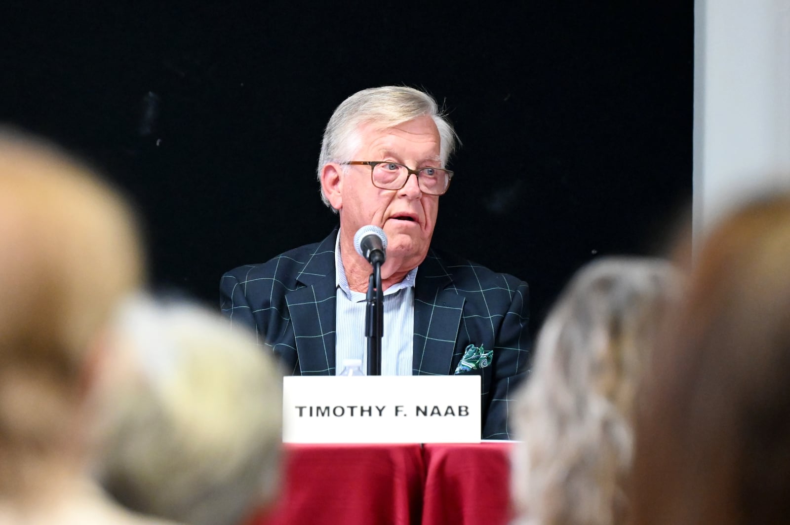 Five people are seeking three open seats on Hamilton City Council in the Nov. 4, 2025, general election. Pictured is incumbent Councilman Tim Naab answering a question during a Sept. 24, 2025, candidates' forum hosted by the Greater Chamber of Commerce at Miami Downtown Hamilton Center on High Street. MICHAEL D. PITMAN/STAFF