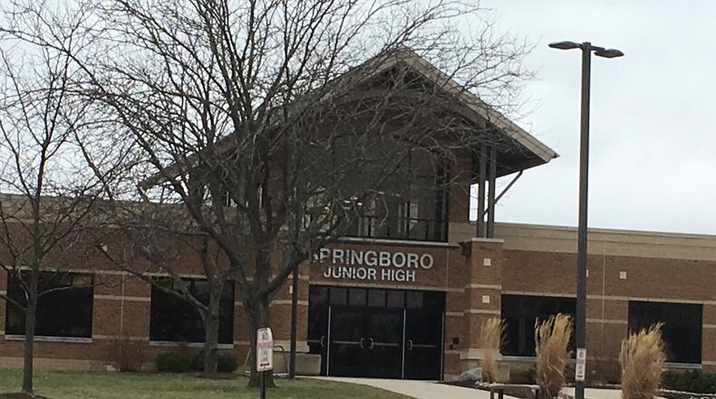 A 12-year-old Clearcreek Twp. boy accused of prompting a lockdown during a dance Friday night at Springboro Junior High School will remain in juvenile detention, pending a risk assessment.
