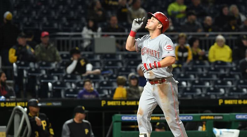 PITTSBURGH, PA - APRIL 11: Scooter Gennett #4 of the Cincinnati Reds points to the sky after hitting a three run home run in the eighth inning during the game against the Pittsburgh Pirates at PNC Park on April 11, 2017 in Pittsburgh, Pennsylvania. (Photo by Justin Berl/Getty Images)