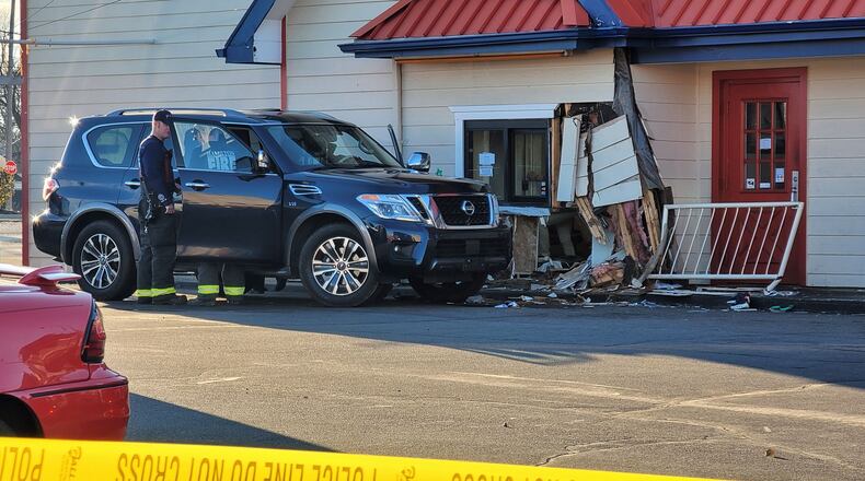 A vehicle crashed inro Jocko's Chicken and Seafood on Hogh Street in Hamilton Wednesday, Dec. 27, 2023. NICK GRAHAM/STAFF