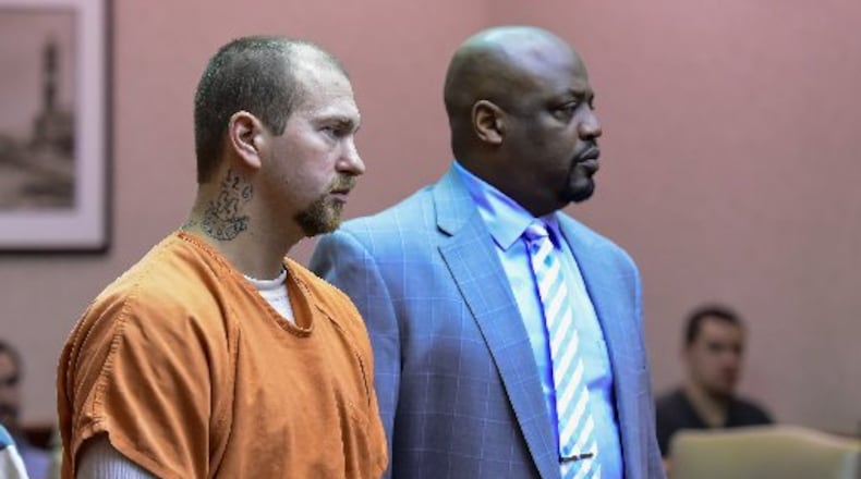 Casey Fryman, one of three people charged in a Middletown murder-for-hire plot, appears in November in Butler County Common Pleas Court with attorney David Washington. STAFF FILE/2016