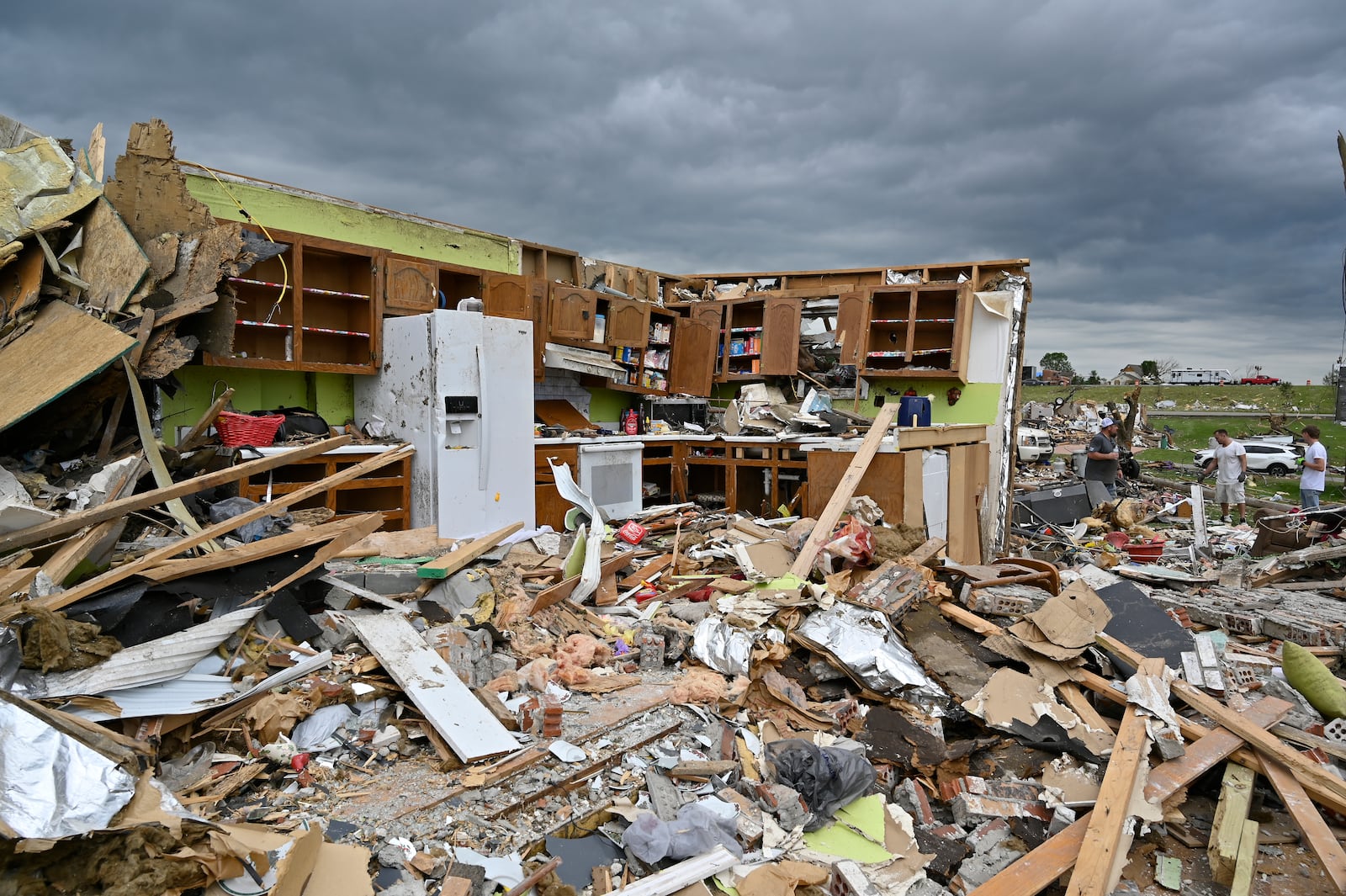 The remains of a kitchen surrounded by debris after severe storms in the Sunshine Hills neighborhood in London, Ky., Monday, May 19, 2025. (AP Photo/Timothy D. Easley)