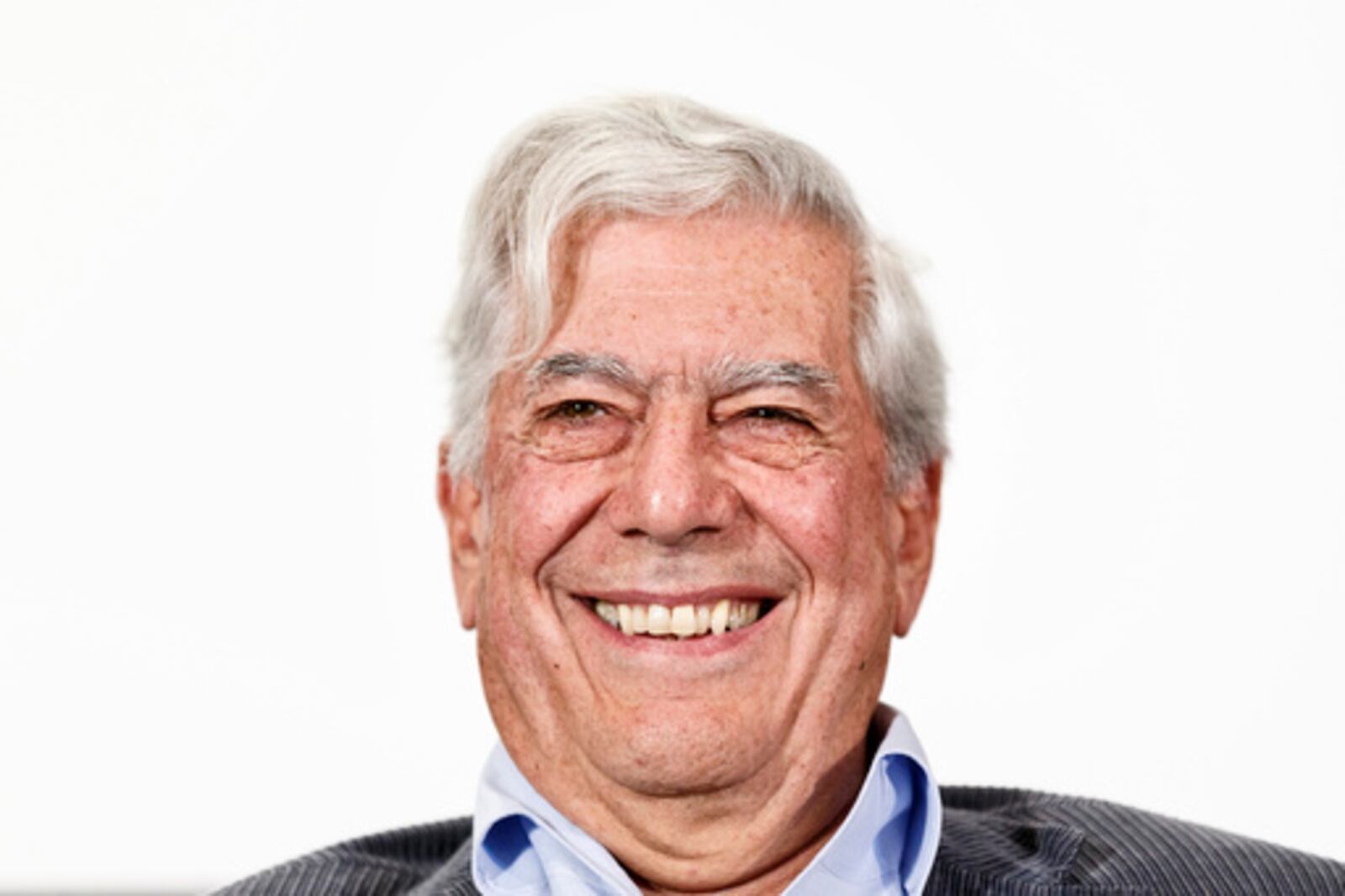 FILE - Peruvian writer and Nobel Prize winner in literature Mario Vargas Llosa smiles during a press conference at the presentation of a new theatre play in Madrid, Spain, April 24, 2013. (AP Photo/Daniel Ochoa de Olza, File)