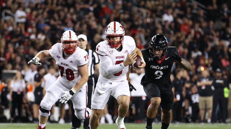 Miami quarterback Brett Gabbert looks for room to run against Cincinnati at Nippert Stadium on Sept. 16, 2023. Miami University Athletics photo