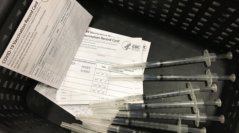 Hundreds of people arrived at the Dayton Convention Center Wednesday morning, Jan. 20, 2021, for the COVID-19 vaccination. MARSHALL GORBY\STAFF