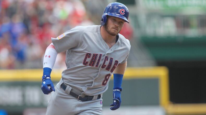 The Cubs’ Ian Happ rounds the bases after a two-run home run in the second inning against the Reds on Sunday, July 2, 2017, at Great American Ball Park in Cincinnati. David Jablonski/Staff