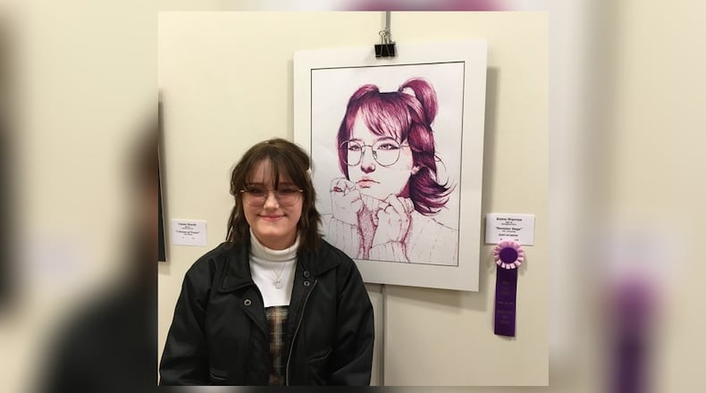 Keira Warren, from Springboro High School, is the winner for Best of Show 2022 for “Sweater Days. "Warren is pictured here with her winning work. CONTRIBUTED
