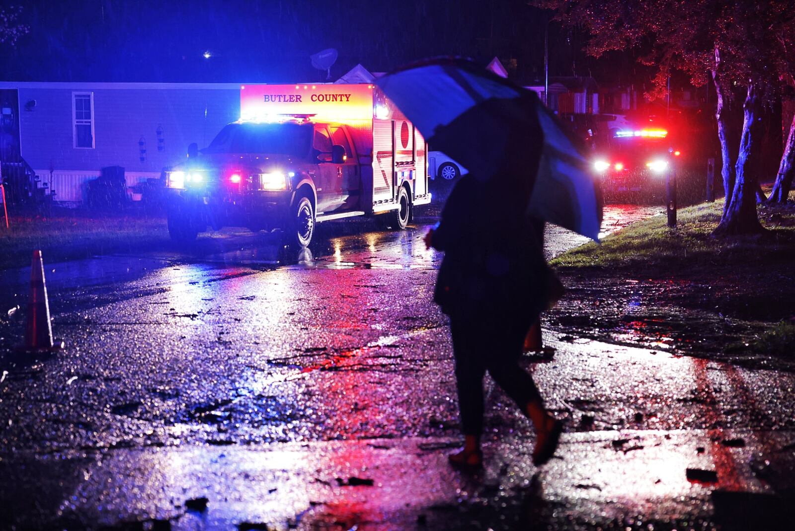 Crews from St. Clair Township, Butler County Sheriff's Office, Butler County Engineers Office, Butler County Emergency Management Agency and others were out assessing damage and cleaning up debris after strong winds ripped through the area of Trenton Road in St. Clair Township Sunday, March 30, 2015. NICK GRAHAM/STAFF