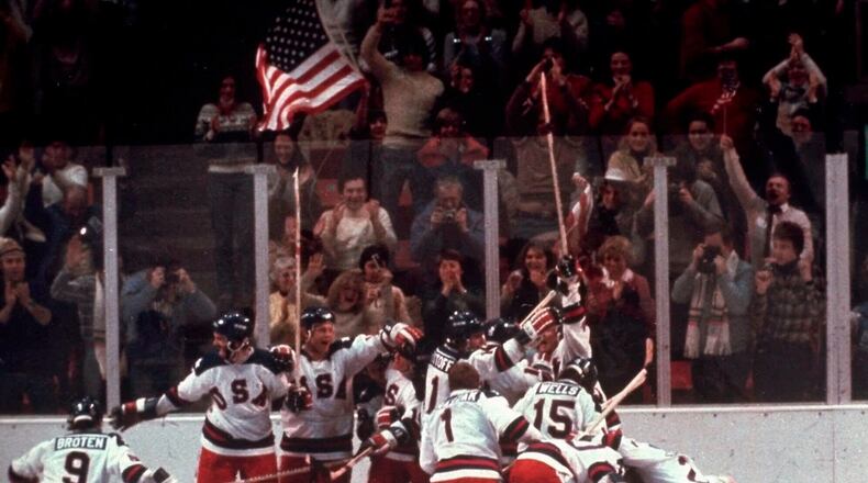 FILE - In this Feb. 22, 1980, file photo, the U.S. hockey team pounces on goalie Jim Craig after a 4-3 victory against the Soviet Union in a medal round match at the the 1980 Winter Olympics in Lake Placid, N.Y. (AP Photo/File)