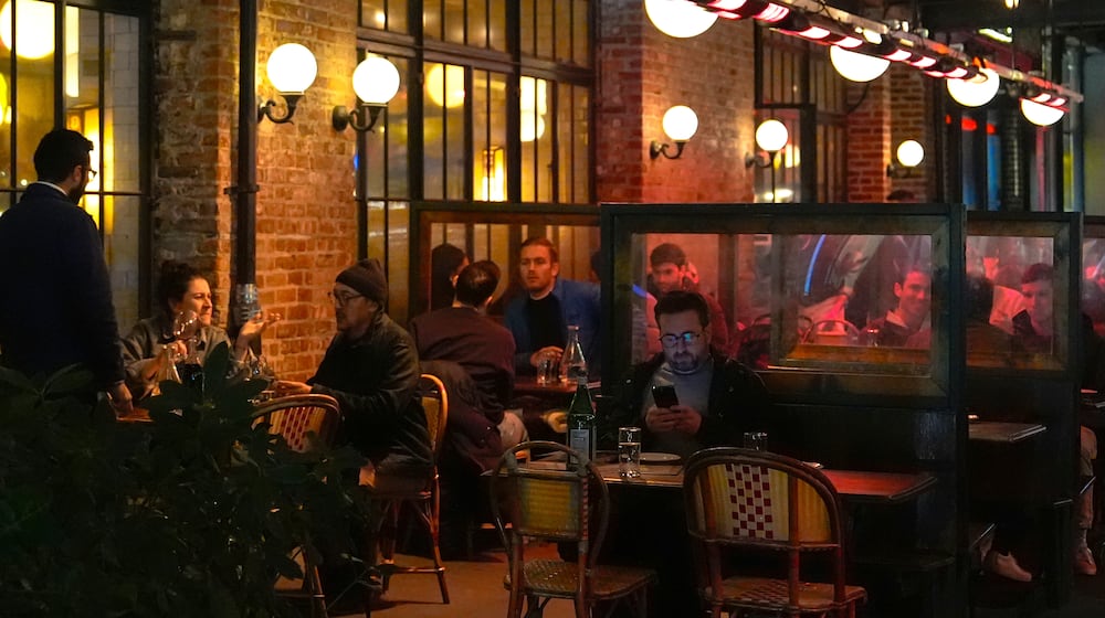 FILE - Diners eat at a restaurant in the Meatpacking District of Manhattan, Nov. 22, 2024, in New York. (AP Photo/Julia Demaree Nikhinson, File)