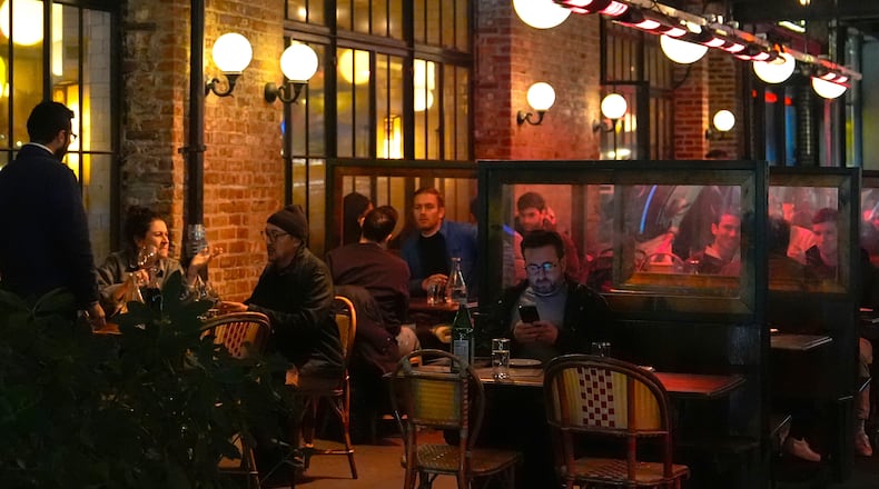 FILE - Diners eat at a restaurant in the Meatpacking District of Manhattan, Nov. 22, 2024, in New York. (AP Photo/Julia Demaree Nikhinson, File)