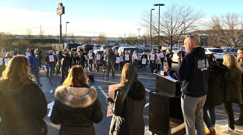 More than a 150 Ross Schools teachers and supporters rallied at the opening of a “strike” headquarters Monday as their union continued to push a possible work stoppage should contract talks not turn in their favor. (Photo By Michael D. Clark/Journal-News)