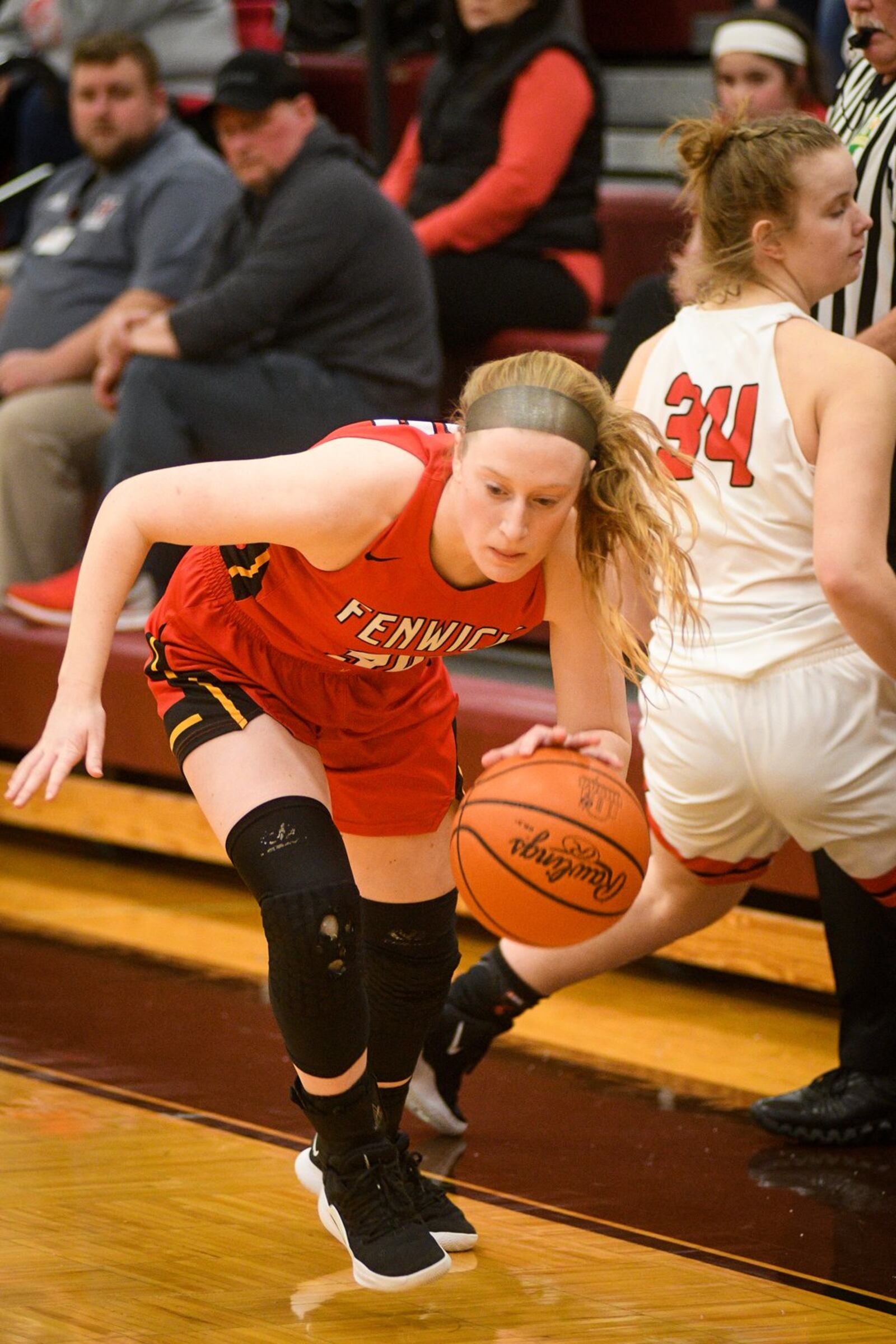 Fenwick’s Elena Daly (30) drives past Franklin’s Brooke Stover (34) during Monday night’s Division II district basketball semifinal at Lebanon. Franklin won 47-35. ROB MCCULLEY/RAM PHOTOGRAPHY