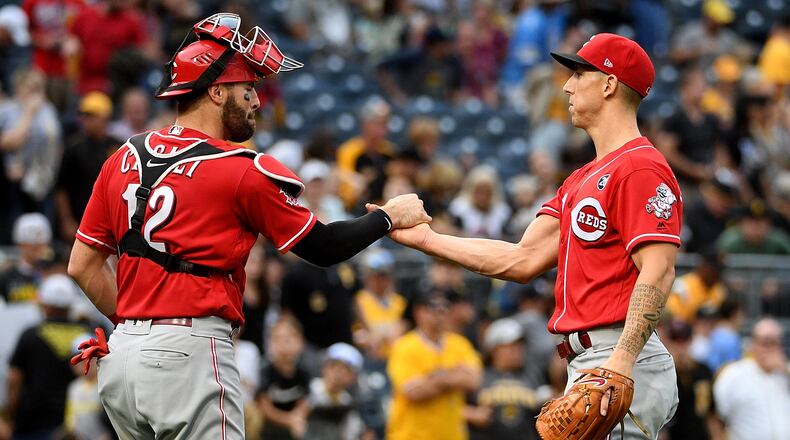 PITTSBURGH, PA - SEPTEMBER 29: Michael Lorenzen #21 of the Cincinnati Reds celebrates with Curt Casali #12 after the final out in a 3-1 win over the Pittsburgh Pirates at PNC Park on September 29, 2019 in Pittsburgh, Pennsylvania. (Photo by Justin Berl/Getty Images)