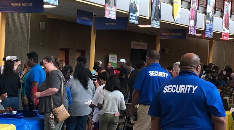 Dayton Public Schools security resource officers work at an August 2019 back-to-school event at Ponitz Career Technology Center. JEREMY P. KELLEY / STAFF