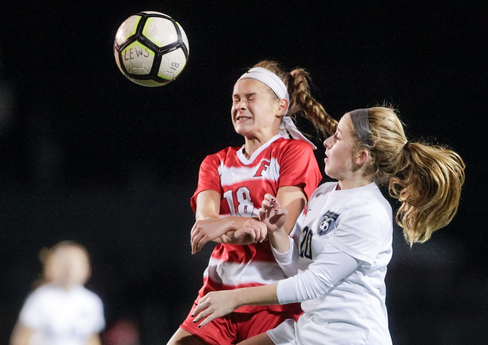 Lakota East's Sophia Amaya (20) and Fairfield's Izzy Wissel (18) battle for the ball during their Division I girls sectional final Tuesday, Oct. 23 at Hamilton High School. Amaya scored in overtime to give East a 2-1 win. NICK GRAHAM/STAFF