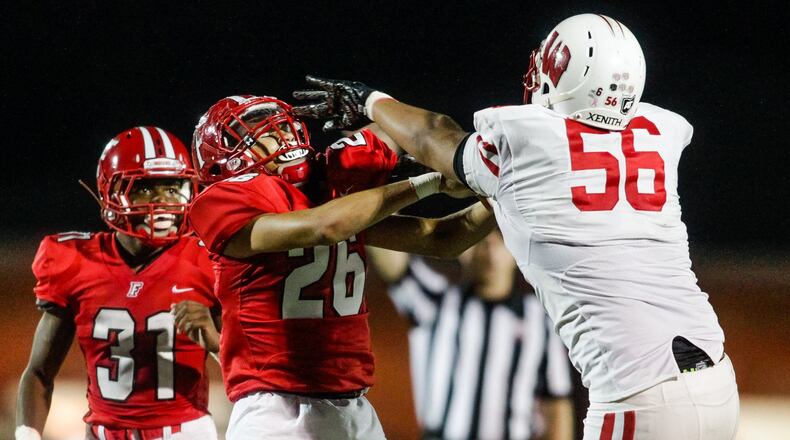Lakota West’s Andre Proffitt (56) and Fairfield’s Elijah Hatfield (26) battle it out as they guard each other during their game Friday, Sept. 14, 2018, at Fairfield Stadium. NICK GRAHAM/STAFF