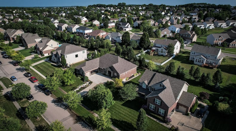 Warren County property values are projected to increase significantly in 2025, driving up real estate taxes. In Springboro, the location of the Settler's Walk neighborhood seen here, property tax rates are expected to jump about 12 or 13%, according to county Auditor Matt Nolan.  JIM NOELKER/STAFF