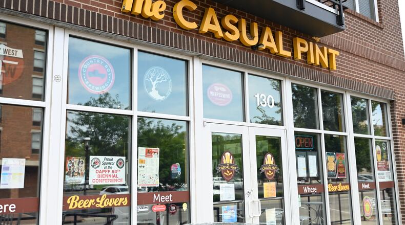 Businesses along and near Riverfront Plaza in downtown Hamilton, Ohio, will collaborate and celebrate Christmas in July. Pictured is The Casual Pint, which is doing a Christmas in July themed game night on Wednesday, July 24, 2024, and hosting a Christmas in July Pop-up Shop on Saturday, July 27, 2024. MICHAEL D. PITMAN/STAFF