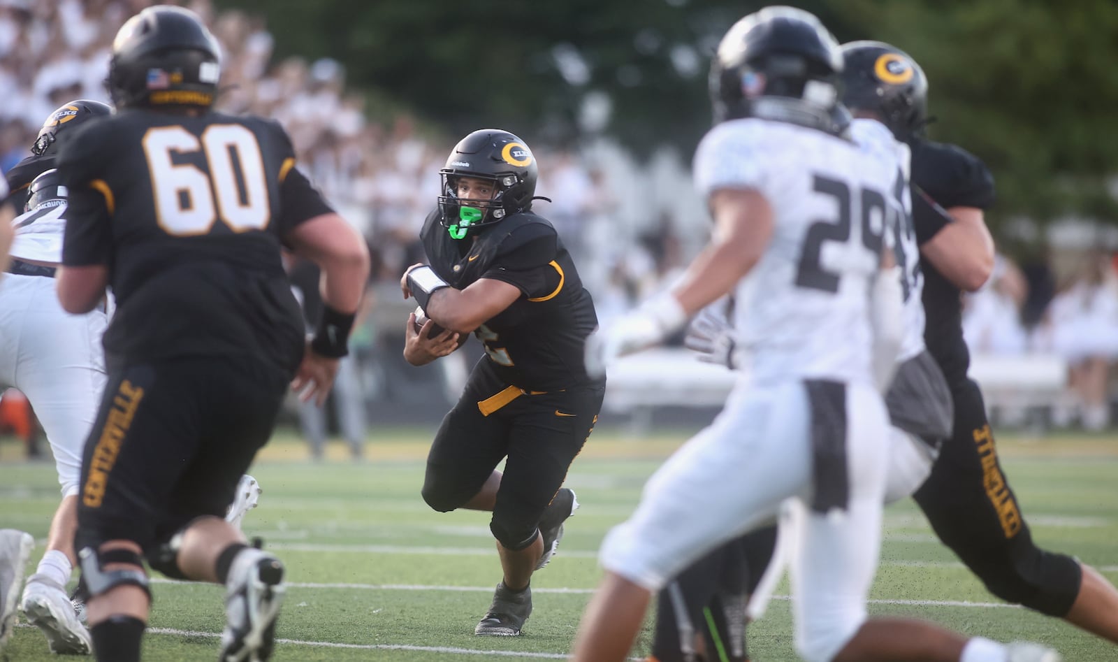 Centerville's Parker Johnson runs against Lakota East on Friday, Aug. 22, 2025, at Centerville Stadium. David Jablonski/Staff