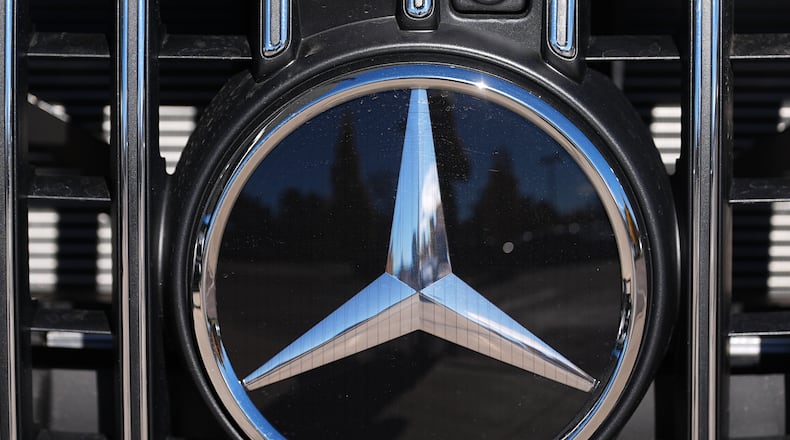 FILE - The company logo is shown on the grille of an unsold 2026 AMG S63 Performance model on the lot of a Mercedes Benz dealership Nov. 2, 2025, in Littleton, Colo. (AP Photo/David Zalubowski, File)