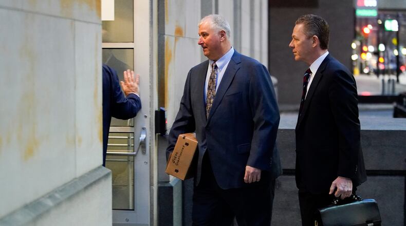 Former Ohio House Speaker Larry Householder, center, walks into Potter Stewart U.S. Courthouse with his attorneys, Mark Marein, left, and Steven Bradley, right, before jury selection in his federal trial, Friday, Jan. 20, 2023, in Cincinnati. Householder and former Ohio Republican Party chair Matt Borges are charged with racketeering in an alleged $60 million scheme to pass state legislation to secure a $1 billion bailout for two nuclear power plants owned by Akron, Ohio-based FirstEnergy. Householder and Borges have both pleaded not guilty. (AP Photo/Joshua A. Bickel)