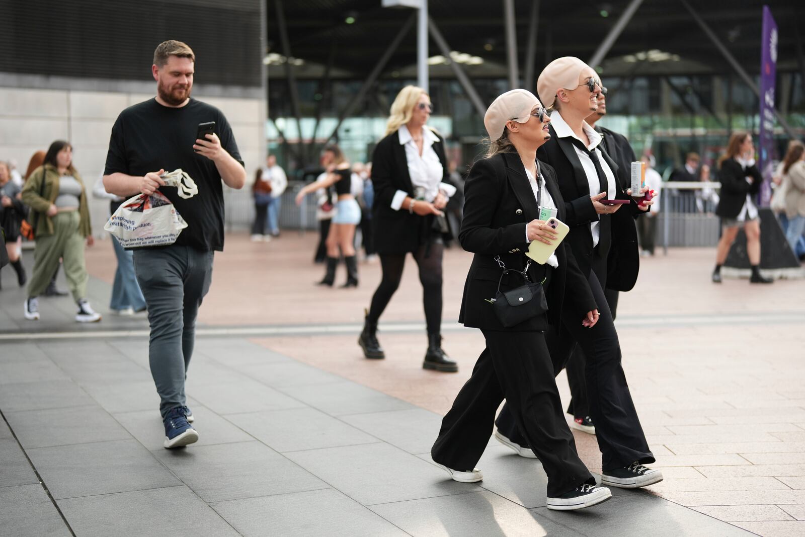 Fans exit North Greenwich Station prior to a performance by Pitbull on Monday, June 9, 2025, in London. (Photo by Scott A Garfitt/Invision/AP)