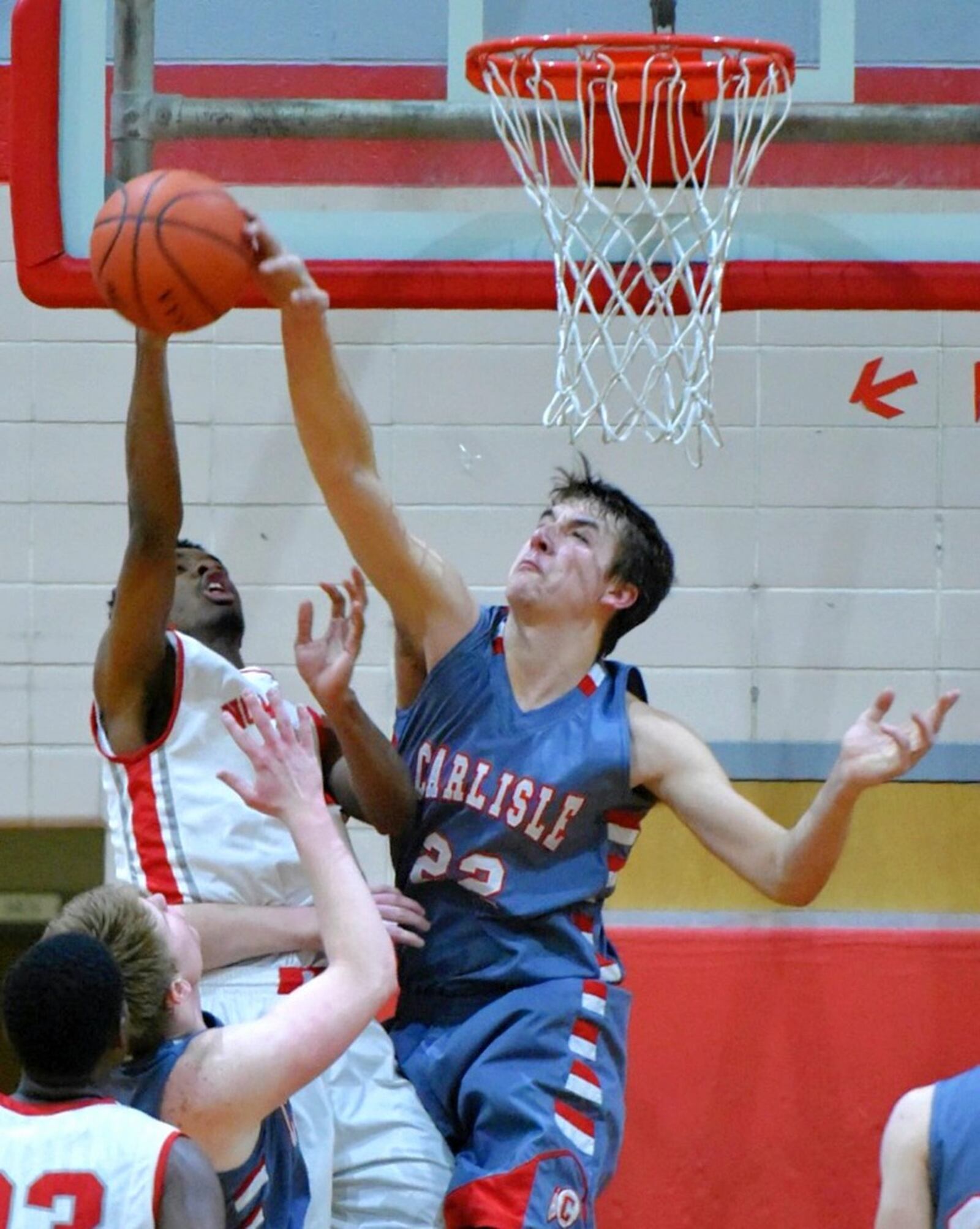 Carlisle’s Justin Flor blocks a shot by Northridge’s Javoni Hill during their game on Feb. 17, 2017, at Northridge. NICK GRAHAM/STAFF
