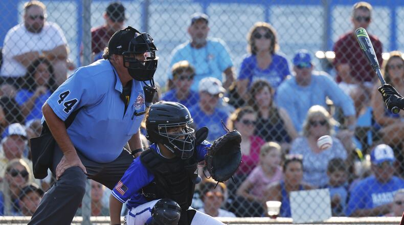 Catcher Anthony Saurber snags a pitch during Hamilton West Side's 13-2 win over New Albany to advance in the Little League state tournament Saturday, July 20, 2024 at West Side Little League field in Hamilton. NICK GRAHAM/STAFF