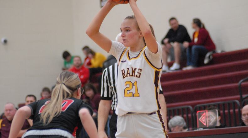 Ross sophomore Carmen Bosse (21) is guarded by Franklin sophomore Cam Parker (20) on Thursday night. Chris Vogt/CONTRIBUTED