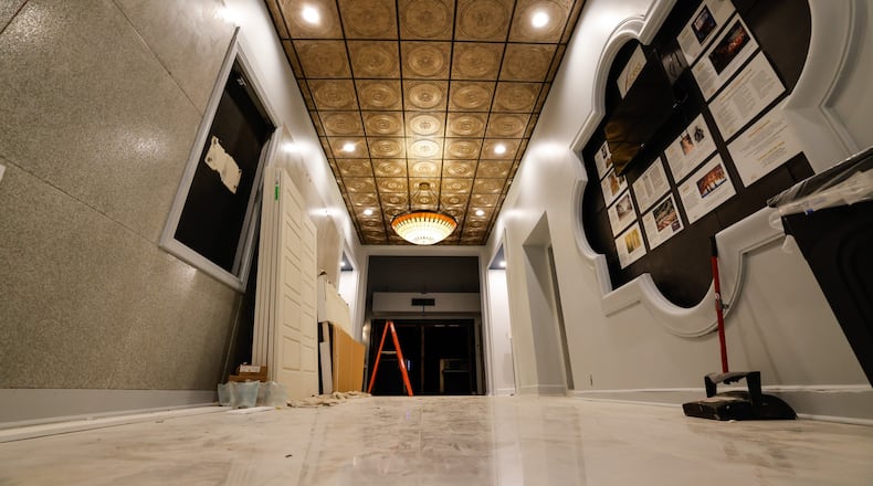 Renovation and restoration continues on Sorg Opera House in Middletown. The entrance hallway is getting a makeover with new flooring, lighting and paint. NICK GRAHAM/STAFF