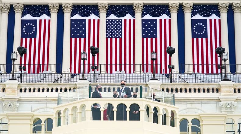 U.S. Secret Service officers check the inauguration stage at the U.S. Capitol in Washington on Friday, Jan. 15, 2021. Law enforcement officials are bracing for more unrest in the days leading up to the inauguration.