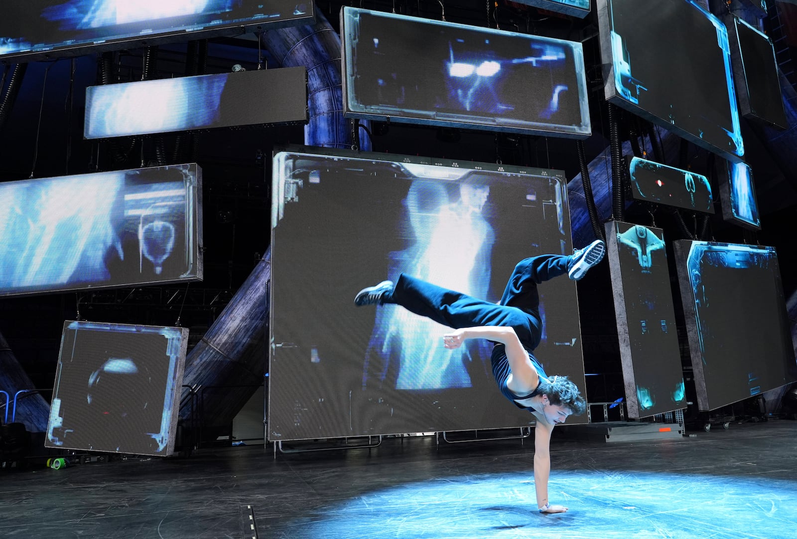 Dancer Diego Pasillas warms up in front of onstage video screens during rehearsals for Katy Perry's "The Lifetimes Tour" at the Toyota Arena on Wednesday, April 9, 2025, in Ontario, Calif. (AP Photo/Chris Pizzello)