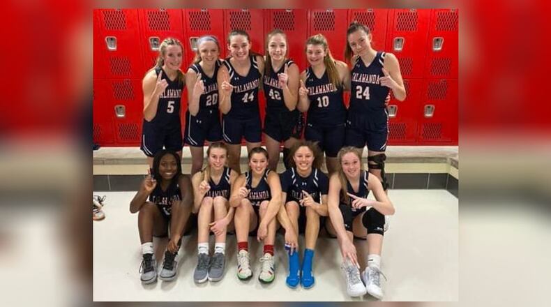 The Talawanda girls’ basketball team celebrated a Southwest Ohio Conference championship after a win at Mount Healthy Jan. 29. CONTRIBUTED