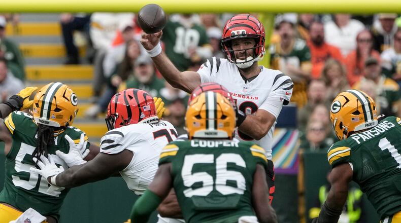 Cincinnati Bengals' Joe Flacco throws under pressure by the Green Bay Packers in the first half of an NFL football game, Sunday, Oct. 12, 2025, in Green Bay, Wis. (AP Photo/Morry Gash)