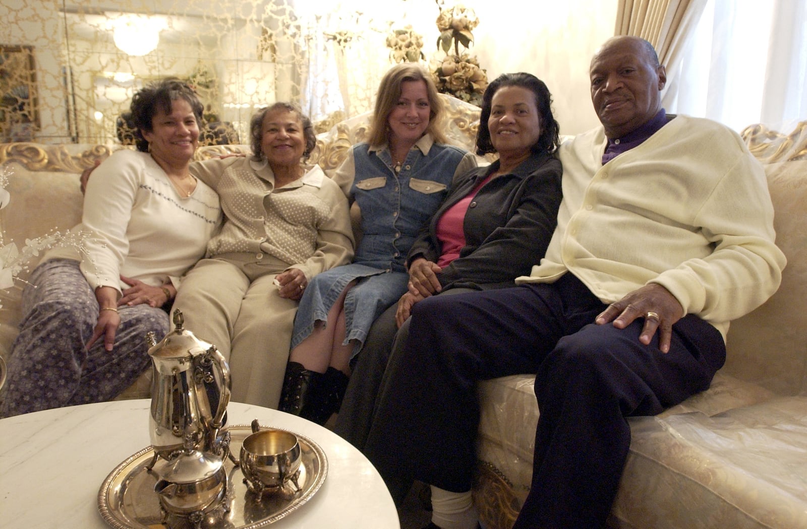 From left, Wilhelmina Prier, Alma Roberts, Debbie Rodgers, Marlene Pringle and Bishop Rudolph Pringle gathered in April 2003 to discuss Rodgers' Good Samaritan efforts. FILE