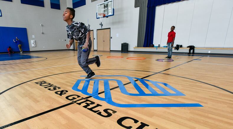 Maurice, a sixth-grader, does the shuttle run in the gym on opening day at the Boys and Girls Club of West Chester/Liberty in the new location on Cincinnati Dayton Road in West Chester Township Thursday, Jan. 4. NICK GRAHAM/STAFF