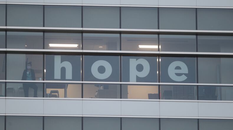 File - First responders flashed "Goodnight Lights" for Dayton Children’s Hospital patients on July 9, 2020. While the tradition began in September 2018, it took on a special meaning during the COVID-19 pandemic as measures to limit the spread of infection meant few visitors for the young patients beyond a parent or legal guardian. JIM NOELKER/STAFF