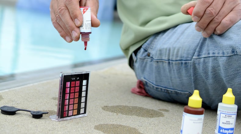Regular maintenance helps eliminate the chance of cryptosporidium, a microscopic parasite can make otherwise healthy adults and children feel sick for up to three weeks. Greg Morrow, maintenance director for the Fairfield Parks Department, tests the chlorine levels in the pool on Wednesday, May 24, 2017, at the Fairfield Aquatics Center prior to its opening this weekend. MICHAEL D. PITMAN/STAFF
