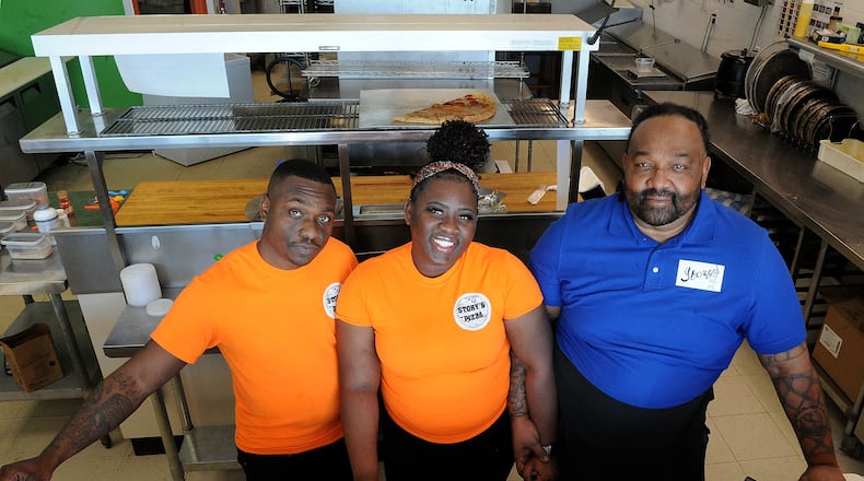 Story's Pizza & Smoothies is a family owned business located at 2741 West Alex Bell Road in Moraine. The Smith family from left, Cory, Ona, and their father, Steve, enjoy running the business. MARSHALL GORBY\STAFF