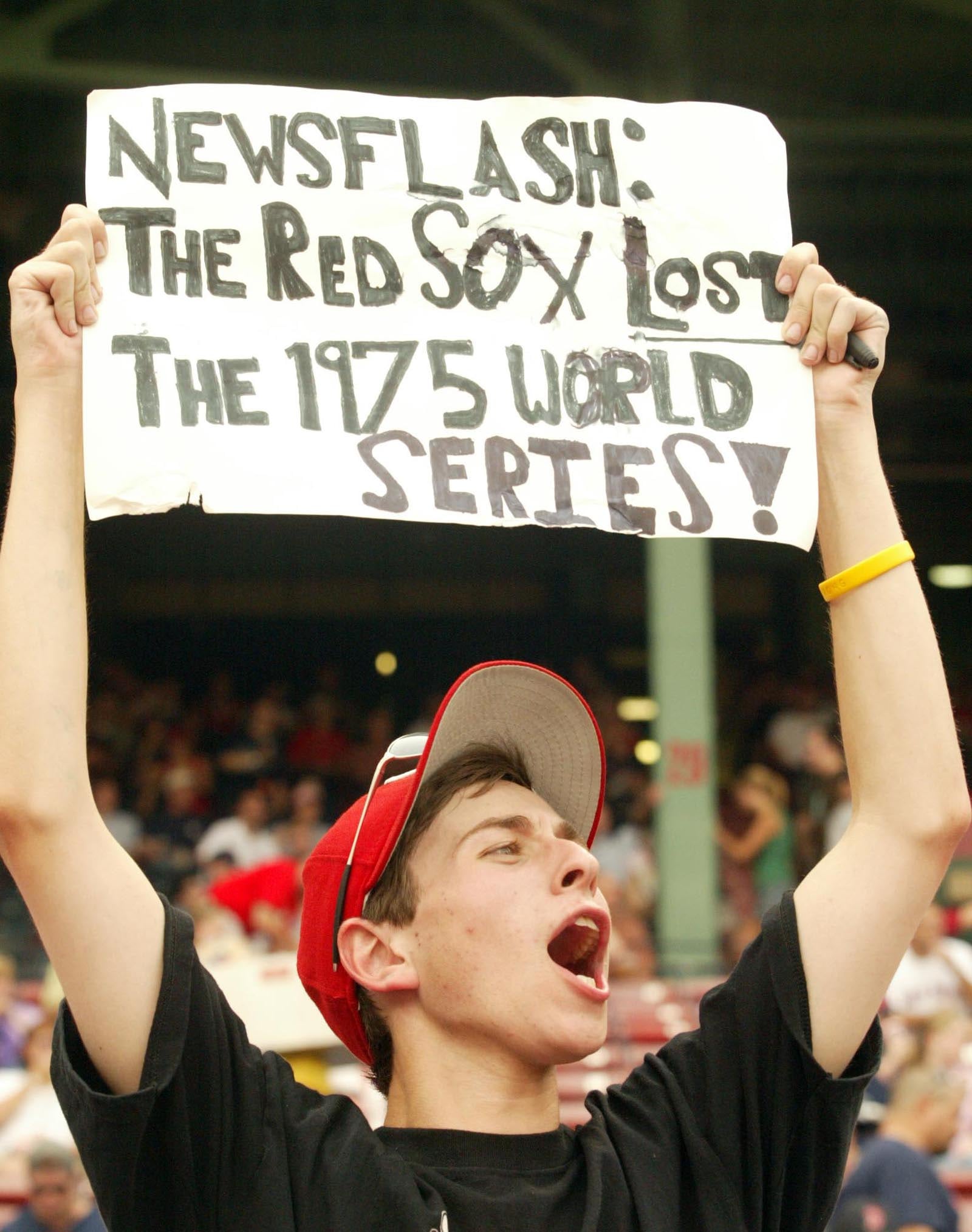 A Reds fans at Fenway Park, reminds the Boston crowd that the Cincinnati Reds won the 1975 World Series. STAFF FILE PHOTO