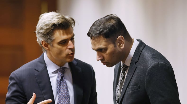 Defense attorney Charles M. Rittgers, left, talks with his client, Gurpreet Singh, during a motions hearing. The jury trial of Gurpreet Singh, charged with allegedly shooting and killing four family members in 2019 in West Chester Township, started with preliminary motions and jury selection Monday, Oct. 3, 2022 in a new super courtroom in Butler County Common Pleas Court in Hamilton. NICK GRAHAM/STAFF