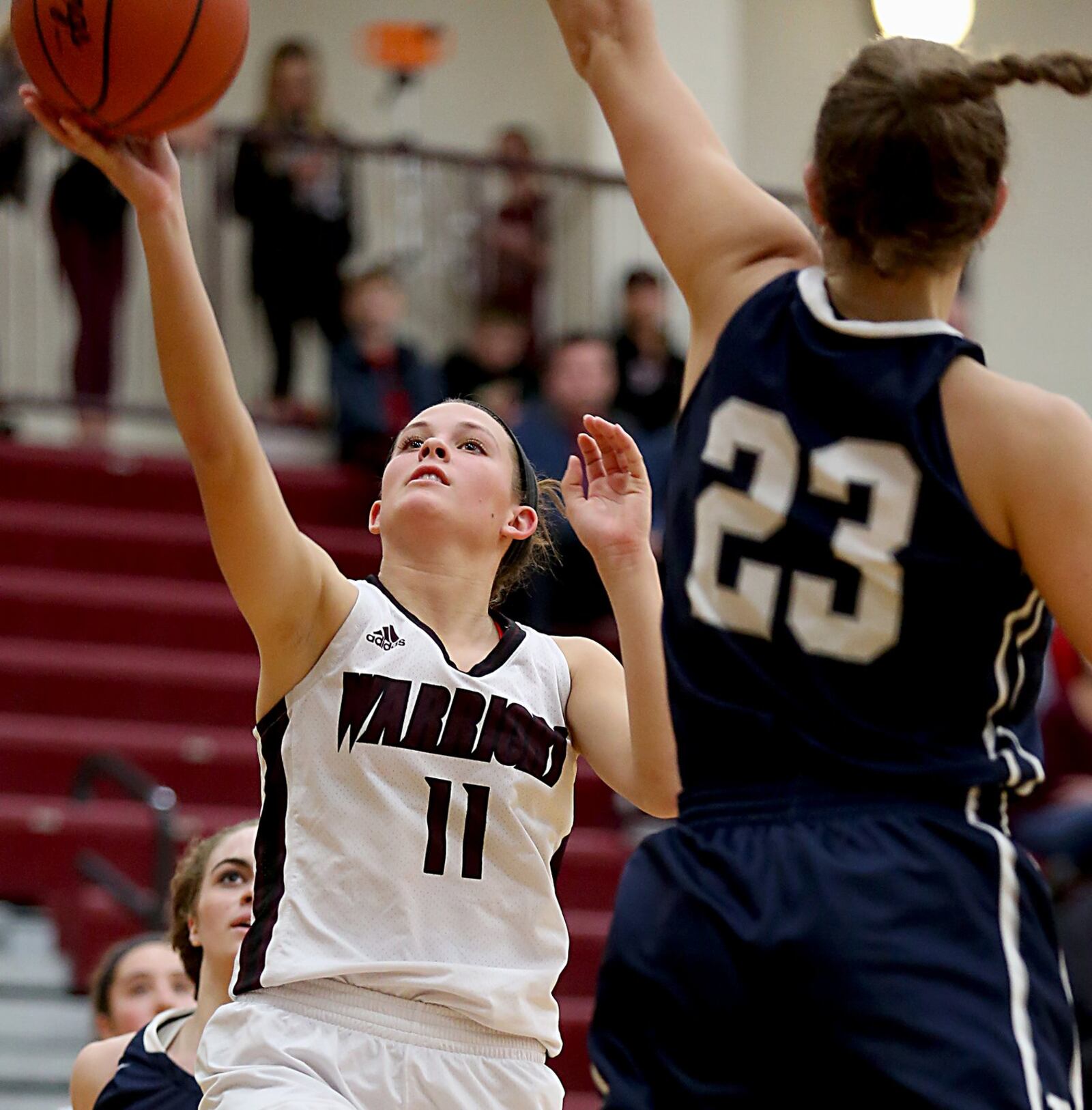 Lebanon guard Ashley West shoots against Edgewood forward Sara Schaefer during their game at Lebanon on Monday night. CONTRIBUTED PHOTO BY E.L. HUBBARD