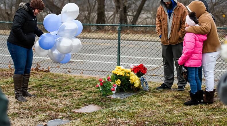Rebecca Sandle left, the mother of CJ Sandle, gathered with friends for a balloon launch on what would have been CJ’s 21st birthday last year. This year she is once asking people to mark the day with a random act of kindness. NICK GRAHAM/STAFF