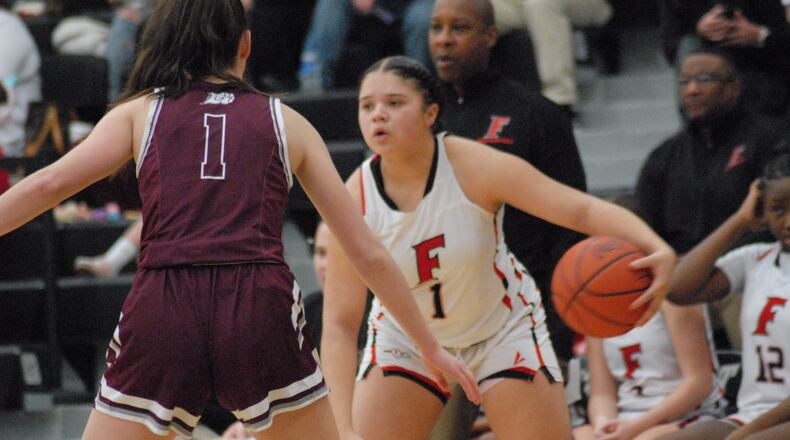 Fairfield senior Kylee Booker is guarded by Lebanon junior Maddie Mueller during their Division I sectional tournament game on Thursday at Lakota East. Chris Vogt/CONTRIBUTED